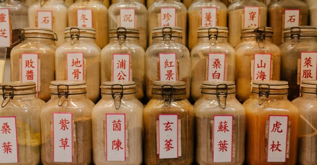A variety of herbal medicine jars with Chinese labels displayed in a shop.